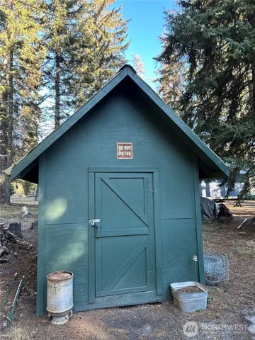 a view of a dry yard with wooden floor and a houses