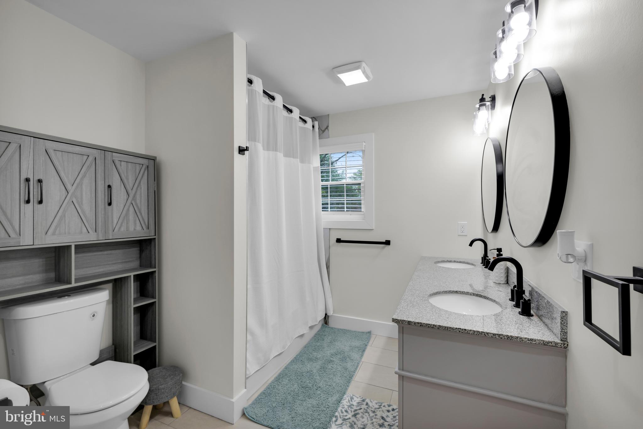 2840 Jacksonville Road Bethlehem, PA 18017 - Photo 27 of 57 a bathroom with a granite countertop sink mirror vanity and toilet