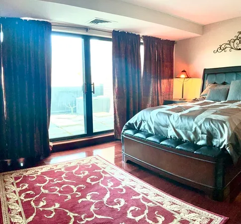 a bedroom with bed and window