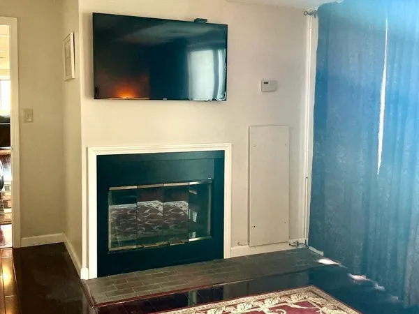 a living room with a fireplace