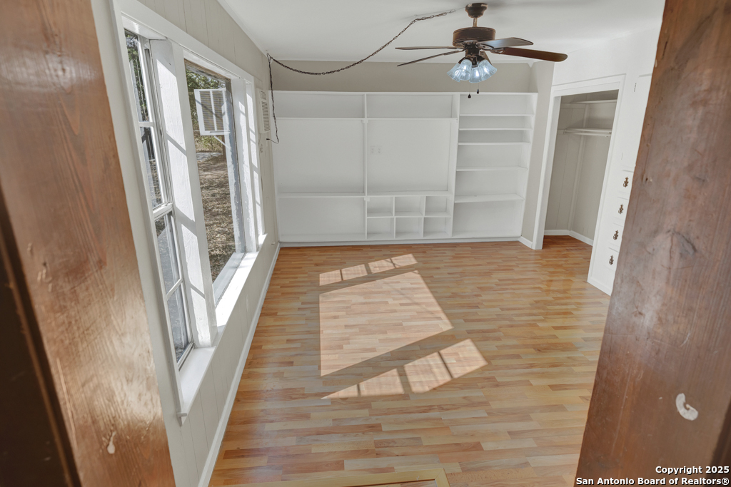 511 Wright Avenue Schertz, TX 78154 - Photo 11 of 23 a view of a hallway with wooden floor and staircase