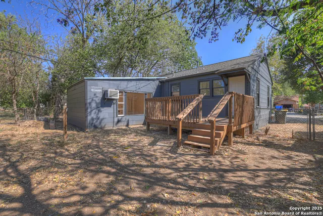 a view of house with a yard