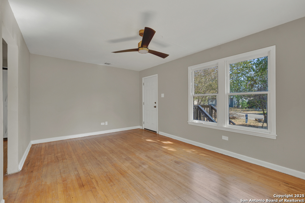 511 Wright Avenue Schertz, TX 78154 - Photo 4 of 23 a view of an empty room with a window