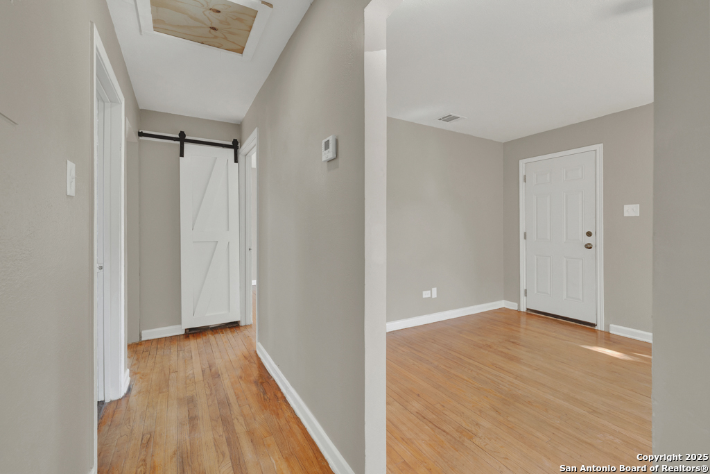 511 Wright Avenue Schertz, TX 78154 - Photo 7 of 23 a view of hallway with wooden floor