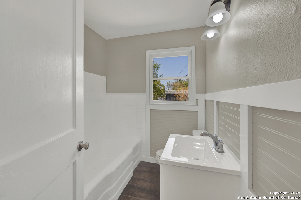 511 Wright Avenue Schertz, TX 78154 - Photo 8 of 23 a bathroom with a sink a toilet and shower