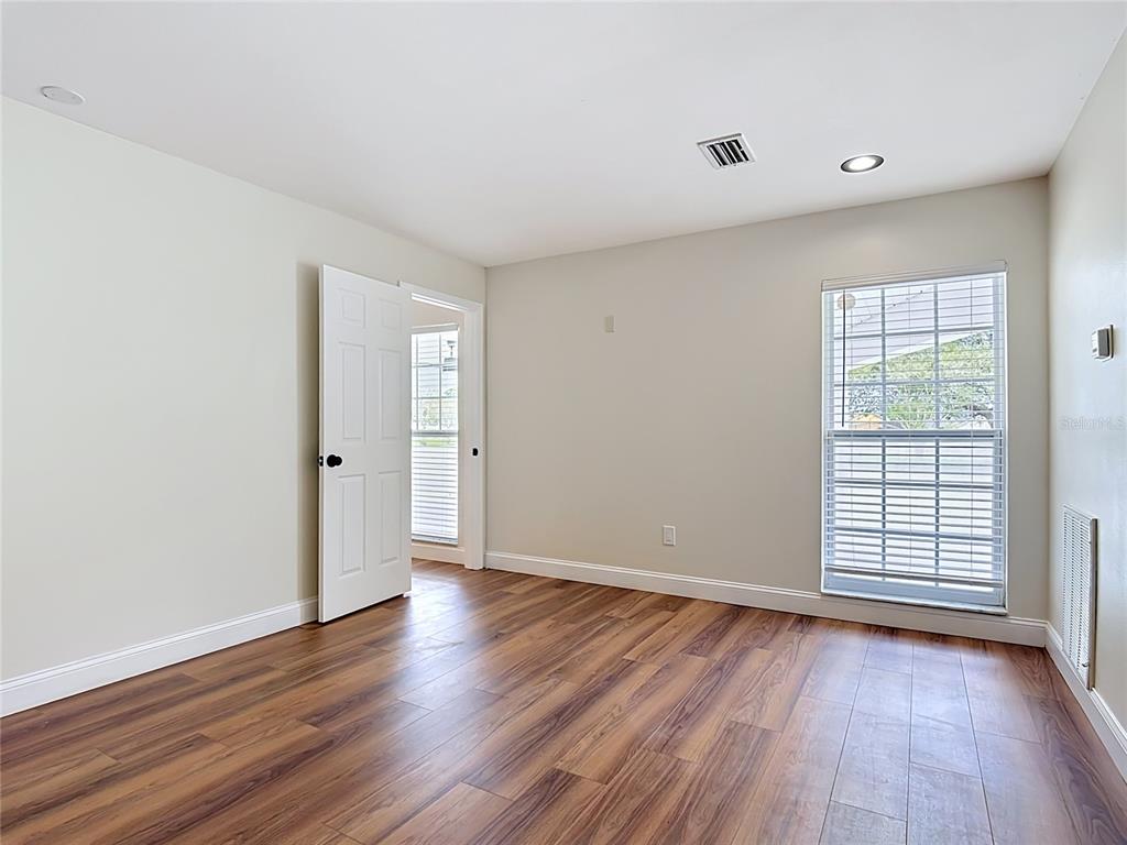 7925 Lake Mabel Loop Road Lake Wales, FL 33898 - Photo 74 of 97 a view of an empty room with wooden floor and a window