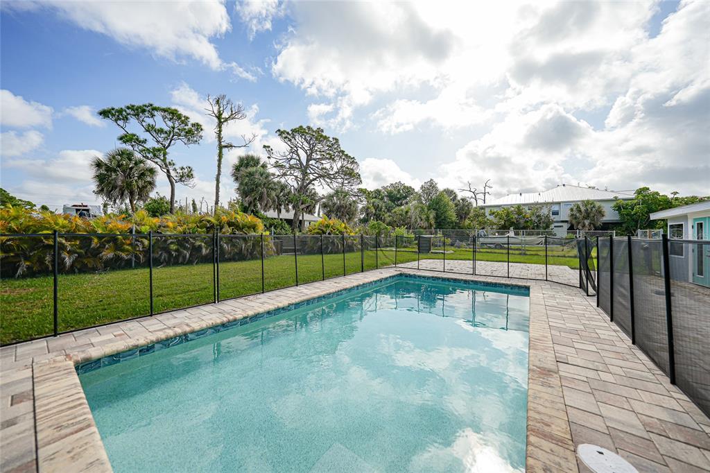 8164 Archie Street Englewood, FL 34224 - Photo 3 of 42 a view of swimming pool with a yard