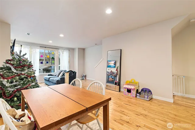 a view of a dining room with furniture and a potted plant