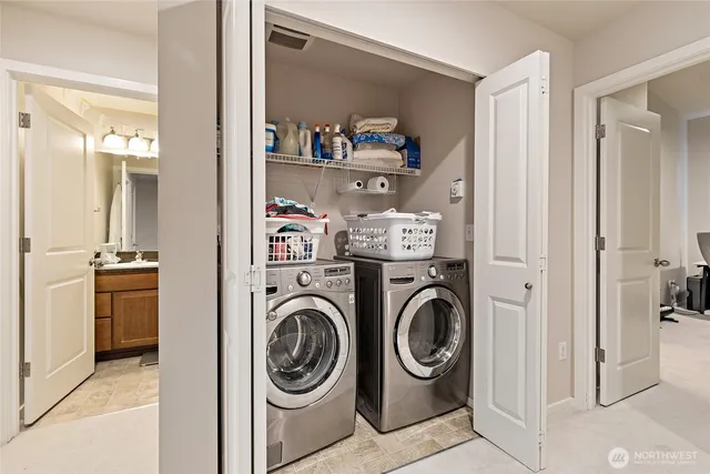 a view of washer and dryer in a utility room