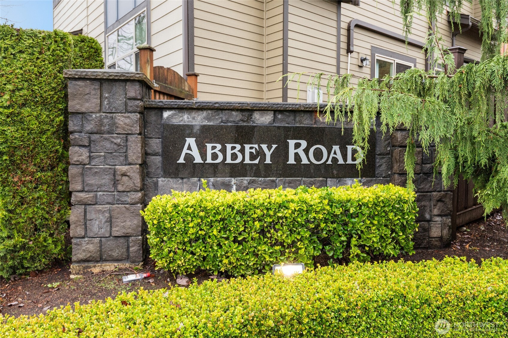 16522 1st Park Southeast Bothell, WA 98012 - Photo 3 of 29 a sign broad in front of flowers