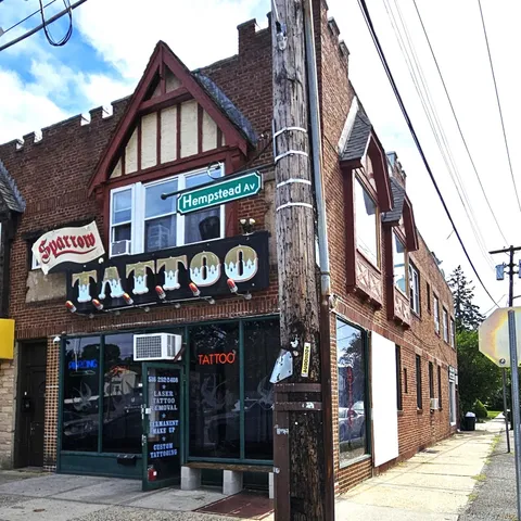 a view of a building with retail shops