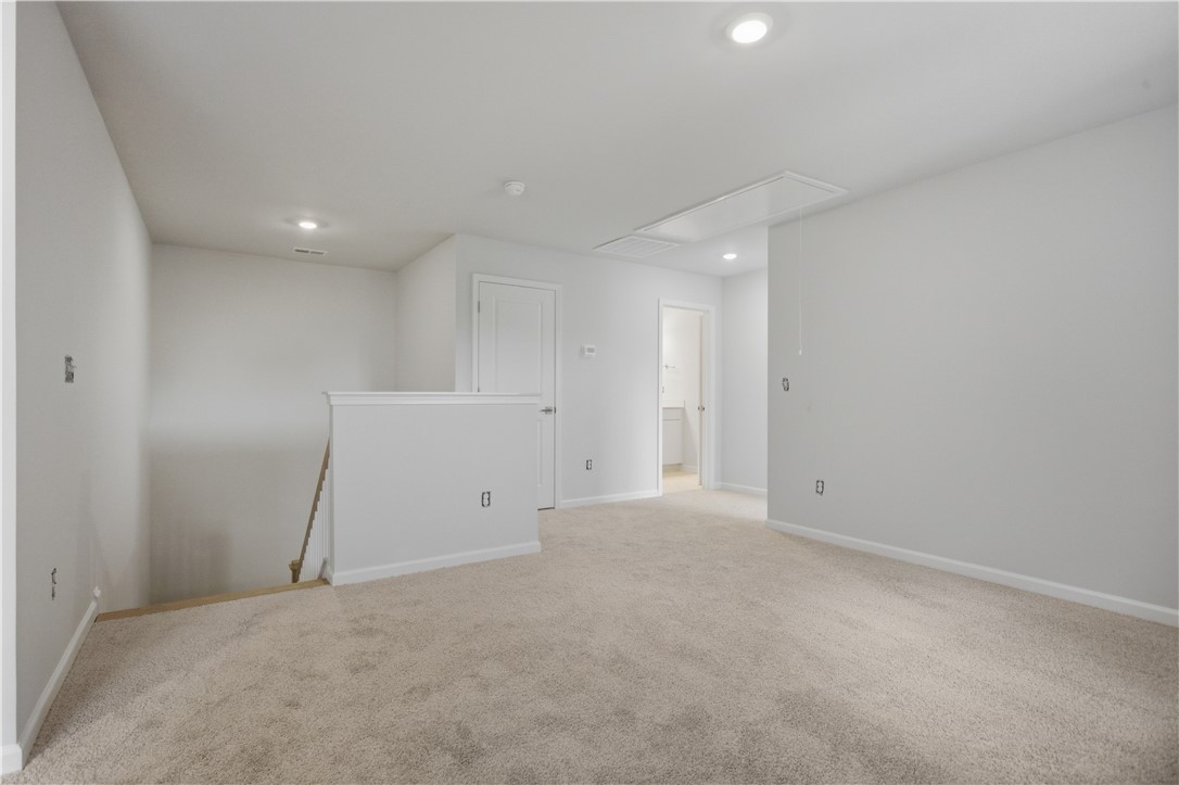 552 Hydrangea Street, Unit LOT 66 Seneca, SC 29678 - Photo 20 of 31 A versatile bonus space offering plush carpeting and recessed lighting, ideal for a flexible living area.