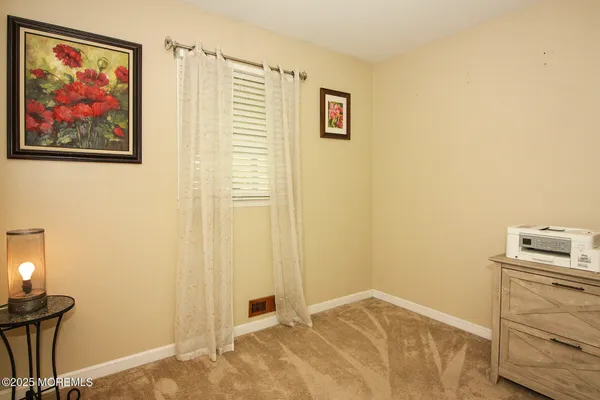 a view of a bedroom with workspace