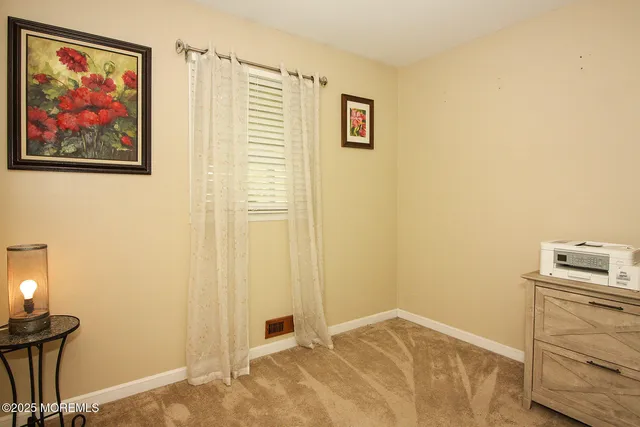 a view of a bedroom with workspace