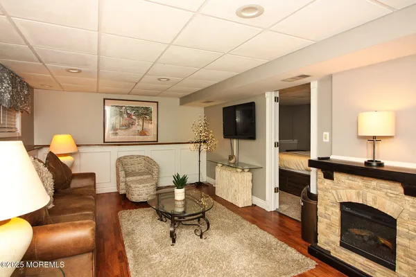 a living room with furniture a fireplace and a table