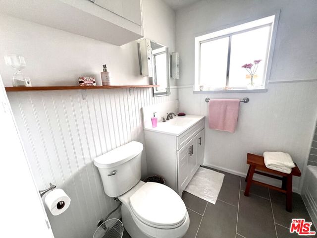 a bathroom with a bathtub sink and toilet