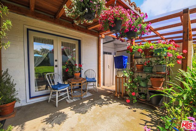 a outdoor living space with furniture and flowers