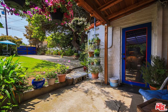 a view of a chairs and table in a patio
