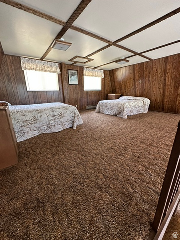 1085 West Elk Road Helper, UT 84526 - Photo 10 of 40 Room featuring wood paneling, a textured ceiling with exposed wood beams, and recessed lighting fixtures