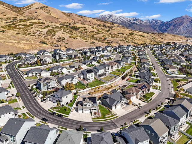 882 Spring Dew Lane Lehi, UT 84048 - Photo 5 of 46 Aerial perspective of suburban area with mountains