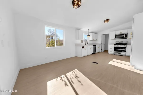 a view of kitchen and workspace