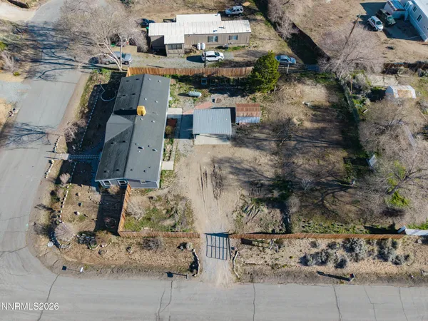 a buildings covered with tall trees