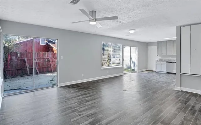 a view of an empty room with a window