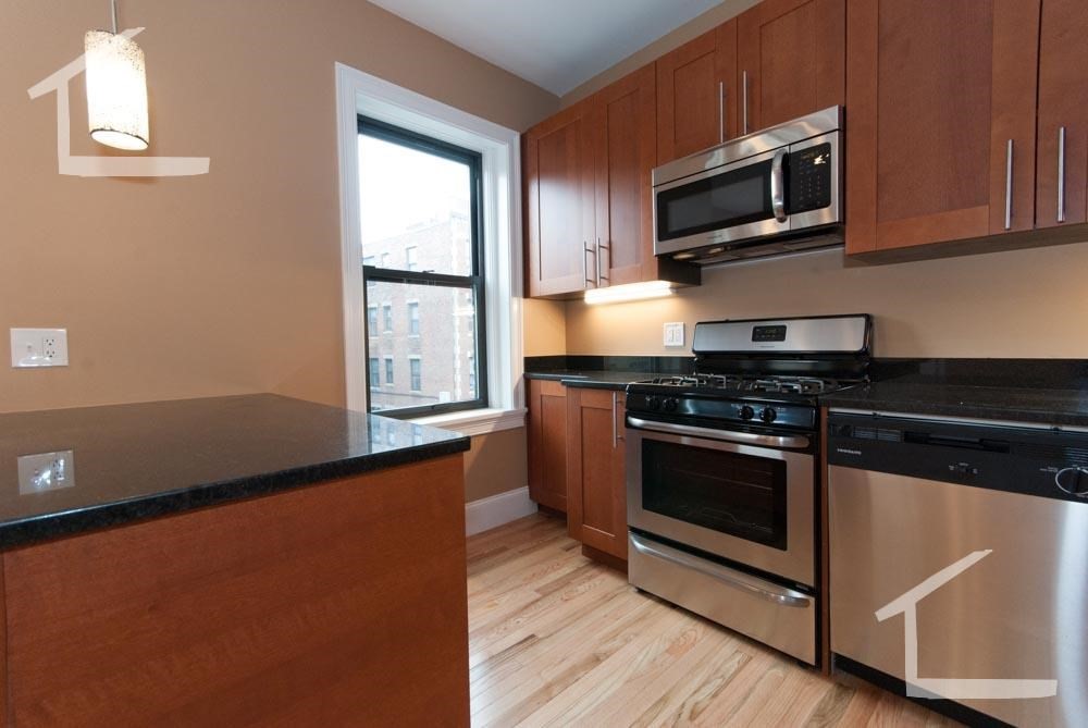 6 Lothian Road, Unit 3 Boston, MA 02135 - Photo 2 of 10 a kitchen with stainless steel appliances a stove microwave and sink