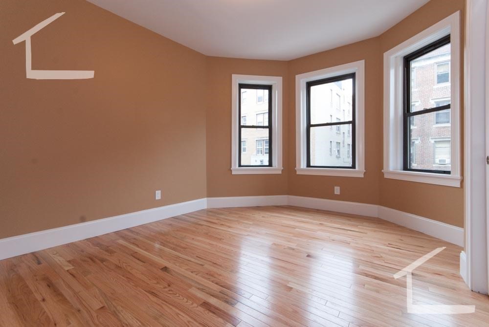 6 Lothian Road, Unit 3 Boston, MA 02135 - Photo 5 of 10 a view of an empty room with wooden floor and windows