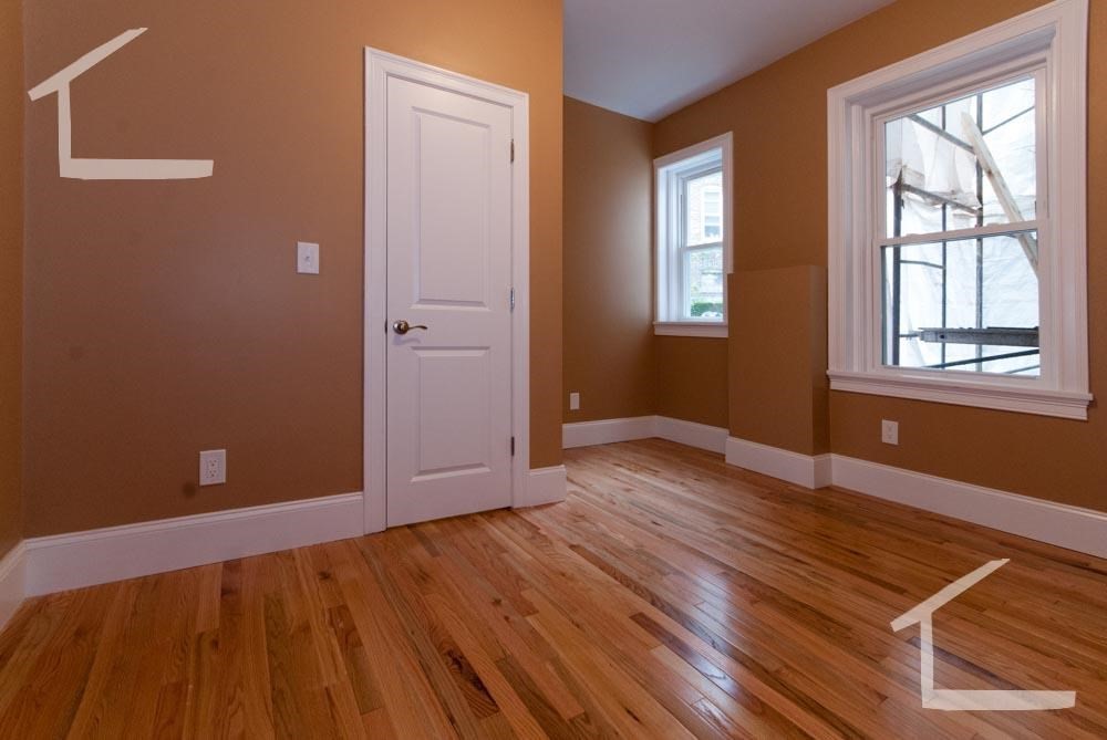 6 Lothian Road, Unit 3 Boston, MA 02135 - Photo 7 of 10 a view of an empty room with wooden floor and a window