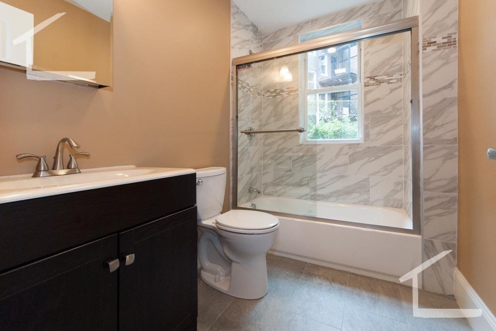 6 Lothian Road, Unit 3 Boston, MA 02135 - Photo 10 of 10 a bathroom with a sink a toilet and a shower