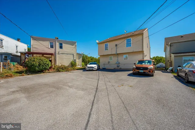 a view of a house with a yard and garage