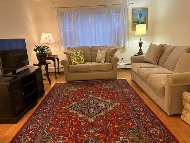 a living room with a couch and a fireplace