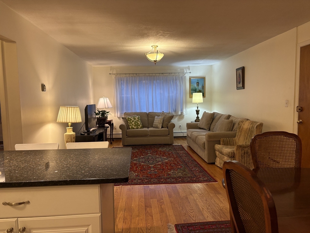 73 Walnut Street, Unit 6 Newton, MA 02460 - Photo 3 of 11 a living room with furniture