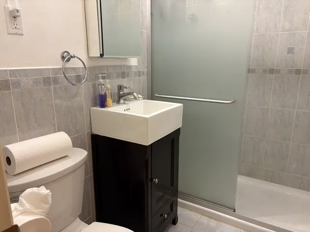 a bathroom with a sink toilet and vanity