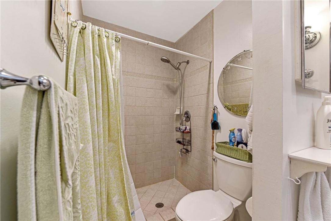 7735 Stanway Place, Unit 7735 Boca Raton, FL 33433 - Photo 16 of 34 a bathroom with a toilet and a shower