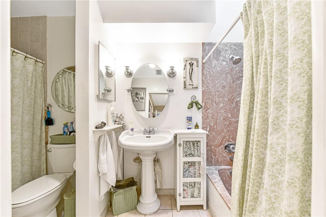 7735 Stanway Place, Unit 7735 Boca Raton, FL 33433 - Photo 18 of 34 a bathroom with a sink toilet and shower