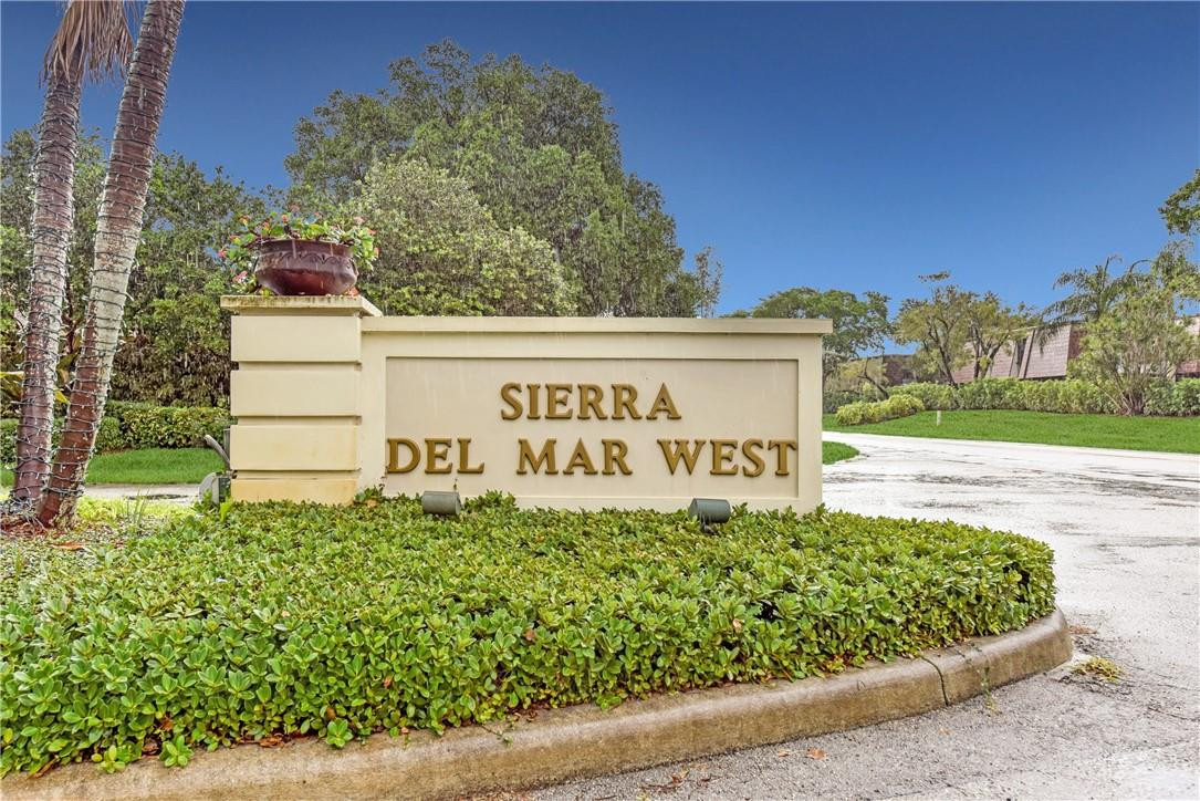7735 Stanway Place, Unit 7735 Boca Raton, FL 33433 - Photo 2 of 34 a sign on the side of a building