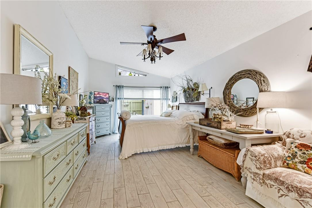 7735 Stanway Place, Unit 7735 Boca Raton, FL 33433 - Photo 21 of 34 a living room with furniture and a chandelier