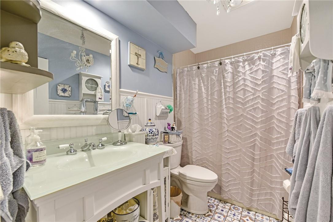 7735 Stanway Place, Unit 7735 Boca Raton, FL 33433 - Photo 24 of 34 a bathroom with a sink toilet and shower