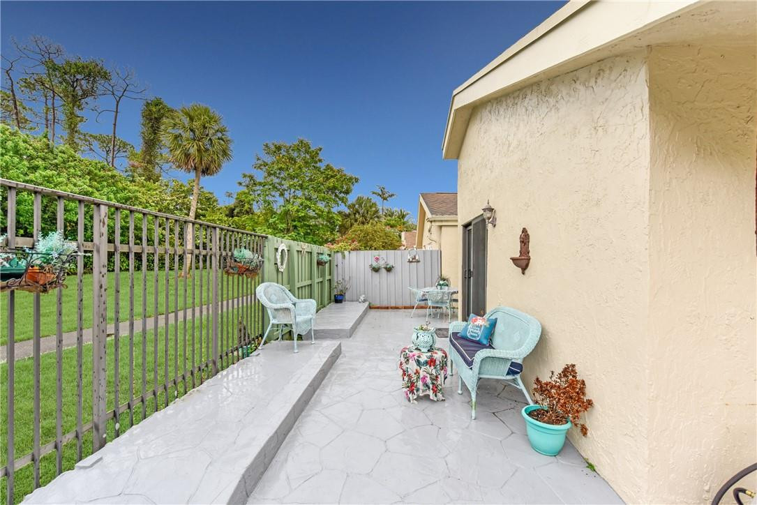 7735 Stanway Place, Unit 7735 Boca Raton, FL 33433 - Photo 8 of 34 a view of a porch with furniture