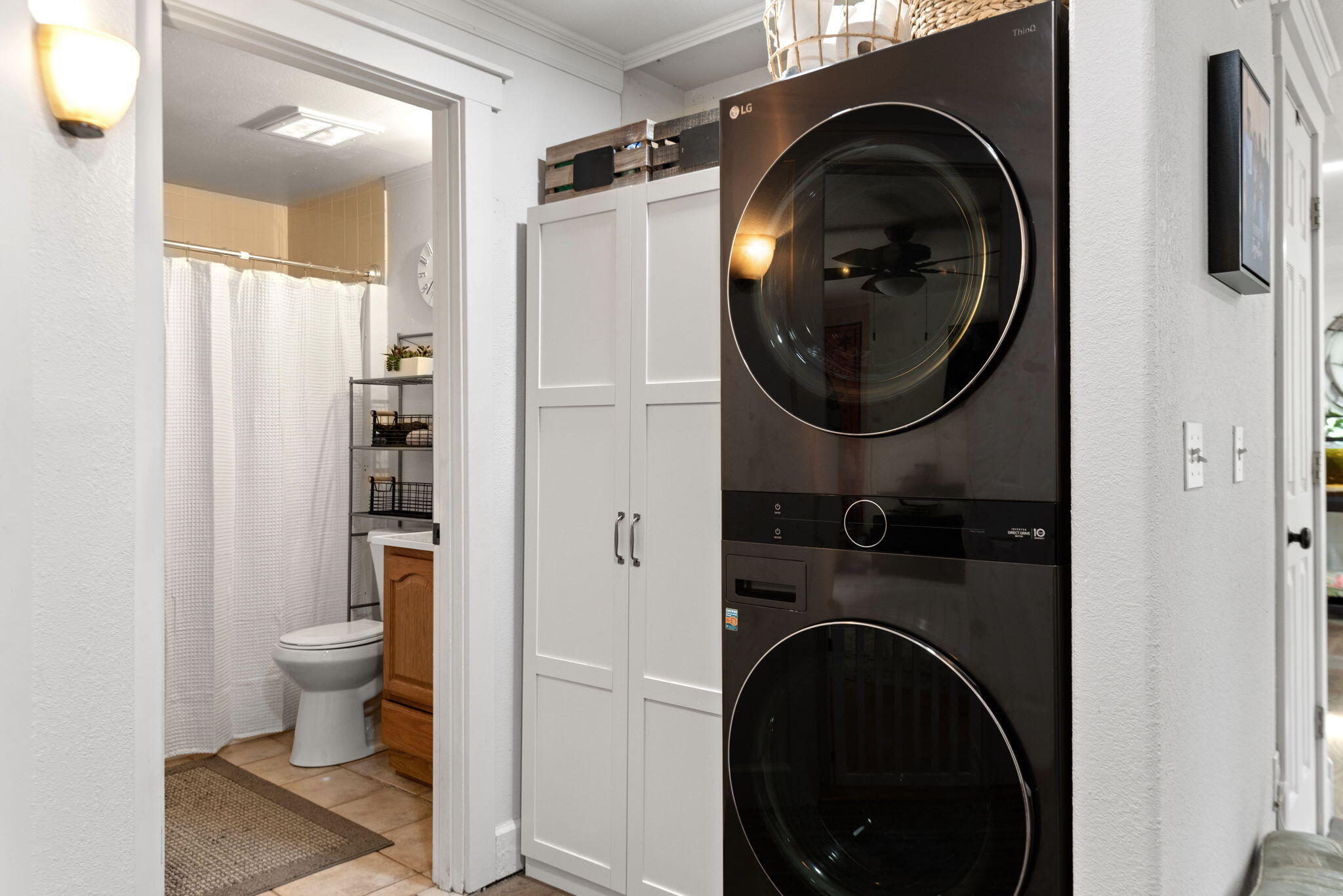 19115 Kiowa Road Bend, OR 97702 - Photo 10 of 35 a view of a hallway with washer and dryer