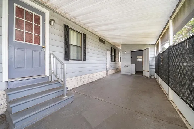 a bathroom with a toilet and a shower curtain