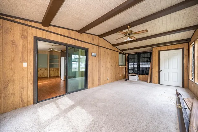 a bathroom with a granite countertop sink a large mirror and a bathtub