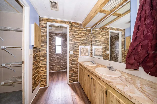 a kitchen with a refrigerator and a sink