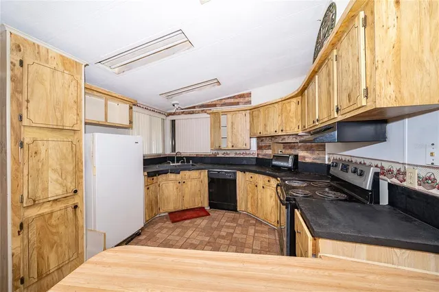 a view of a room with drop ceiling windows and carpet
