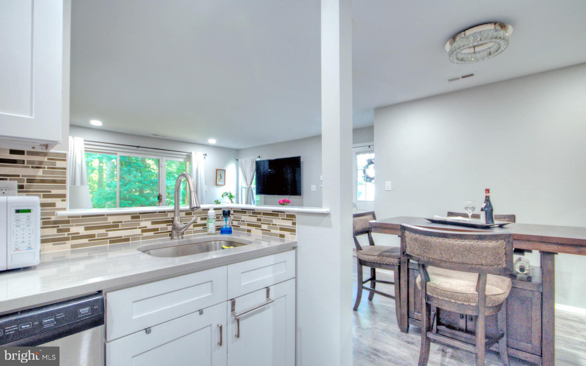 405 Quail Road Marlton, NJ 08053 - Photo 14 of 29 a kitchen with a table and chairs in it