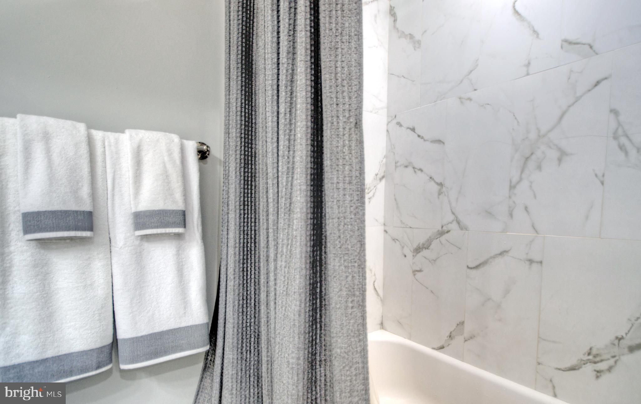 405 Quail Road Marlton, NJ 08053 - Photo 21 of 29 a bathroom with a bathtub and shower