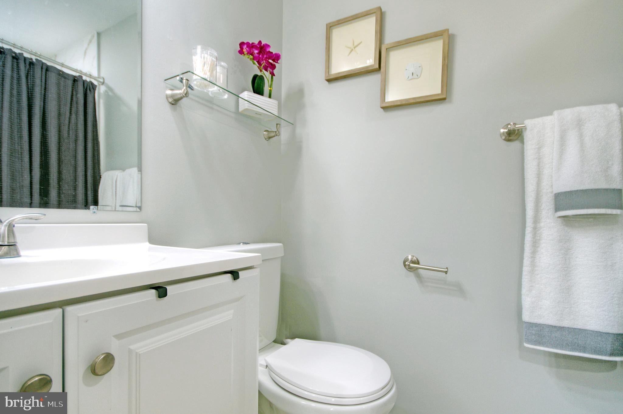 405 Quail Road Marlton, NJ 08053 - Photo 22 of 29 a bathroom with a sink vanity mirror and toilet