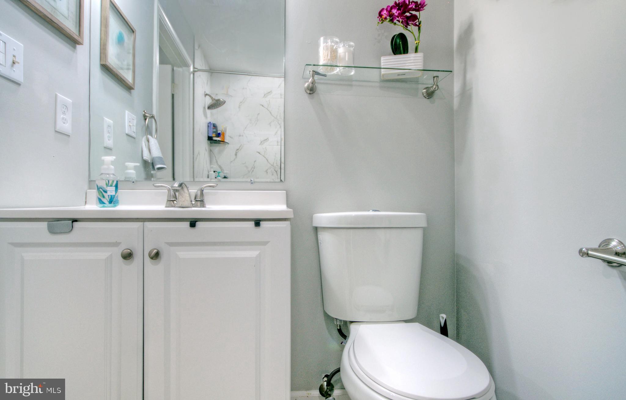 405 Quail Road Marlton, NJ 08053 - Photo 23 of 29 a white toilet sitting next to a bathroom sink
